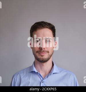 passport photo of cute and well dressed Caucasian man in shirt Stock Photo