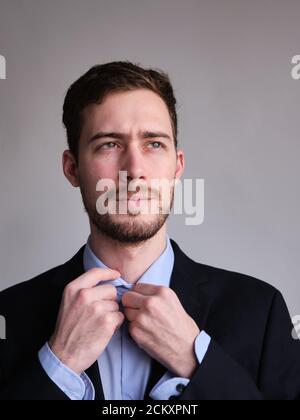 passport photo of cute and well dressed Caucasian man in jacket shirt or suit and tie Stock Photo