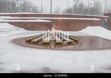The eternal flame burns in the winter time Stock Photo