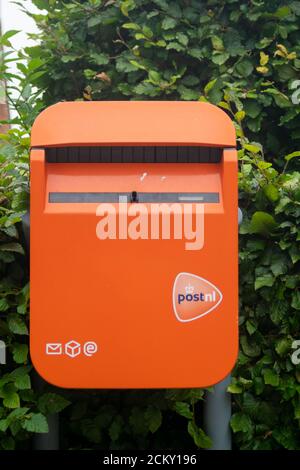 Orange Dutch post office letterbox in The Netherlands, Europe Stock ...
