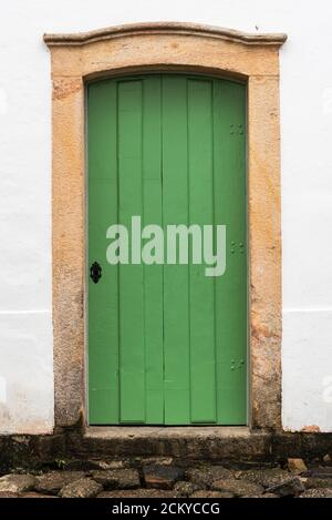 Close-up on green door frame of old colonial portuguese house in Brazil Stock Photo