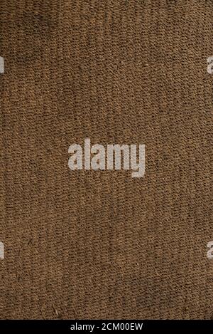 dense floor rug with granular texture of orange color Stock Photo