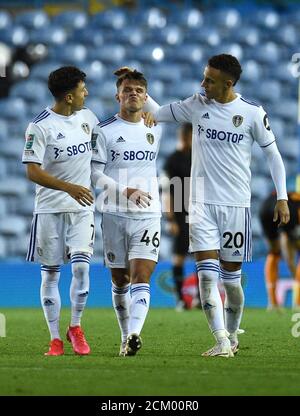 Leeds United's Jamie Shackleton (centre) consoled for missing a decisive penalty in the shoot-out during the Carabao Cup second round match at Elland Road, Leeds. Stock Photo