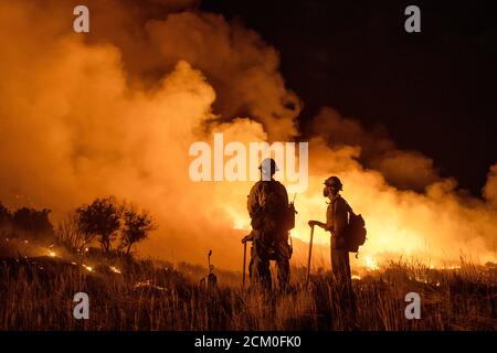 Wyoming Hotshots during night operations at the Pine Gulch Fire on the Western Slope August 2, 2020 near Grand Junction, Colorado. The wildfire is the largest in the history of Colorado destroying tens of thousands of ranch and wildlife habitats. Stock Photo