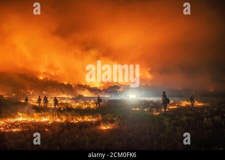 Wyoming Hotshots during night operations at the Pine Gulch Fire on the Western Slope August 3, 2020 near Grand Junction, Colorado. The wildfire is the largest in the history of Colorado destroying tens of thousands of ranch and wildlife habitats. Stock Photo