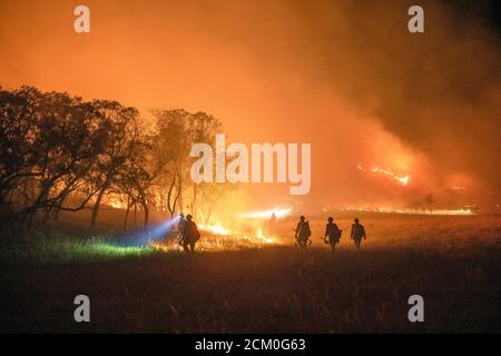 Wyoming Hotshots during night operations at the Pine Gulch Fire on the Western Slope August 3, 2020 near Grand Junction, Colorado. The wildfire is the largest in the history of Colorado destroying tens of thousands of ranch and wildlife habitats. Stock Photo