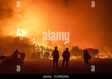 Wyoming Hotshots during night operations at the Pine Gulch Fire on the Western Slope August 3, 2020 near Grand Junction, Colorado. The wildfire is the largest in the history of Colorado destroying tens of thousands of ranch and wildlife habitats. Stock Photo