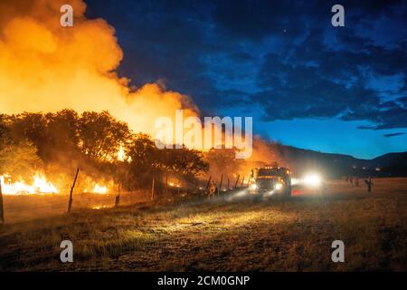 Wyoming Hotshots during night operations at the Pine Gulch Fire on the Western Slope August 2, 2020 near Grand Junction, Colorado. The wildfire is the largest in the history of Colorado destroying tens of thousands of ranch and wildlife habitats. Stock Photo