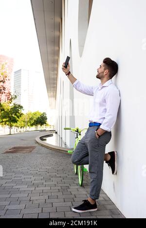 Portrait of stylish handsome young Young man taking selfies with phone Stock Photo