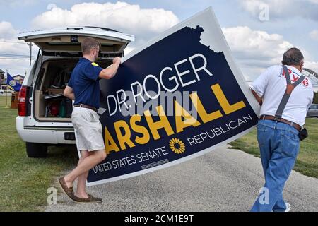 Emporia Kansas, USA. 16th Sep, 2020. Local Republican supporters unload Dr. Roger Marshall senate candidate large yard signs at the Lyon County fairgrounds. Credit: Mark Reinstein/Media Punch/Alamy Live News Stock Photo