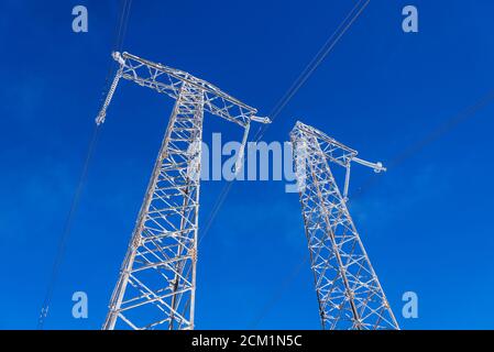 Electricity pylons in winter mountains in Bulgaria Stock Photo - Alamy