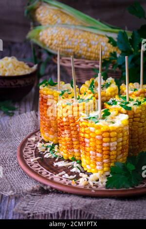 Boiled corn cobs with spices Stock Photo