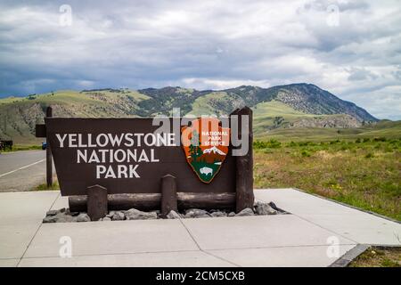 Yellowstone NP, WY, USA - June 23, 2019: A welcoming signboard at the entry point of the preserve park Stock Photo