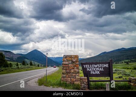 Yellowstone NP, WY, USA - July 5, 2019: A welcoming signboard at the entry point of the preserve park Stock Photo