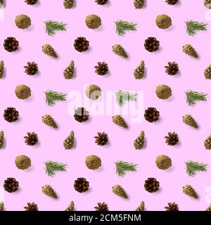 christmas seamless patterns with Pine cones wine cork and lingonberry. pattern christmas seamless on a pink backdrop. Realistic photo collage. Stock Photo