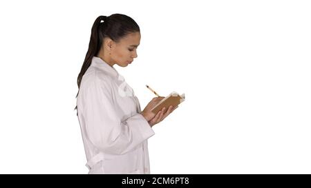 Successful medical doctors making notes while walking on white b Stock Photo