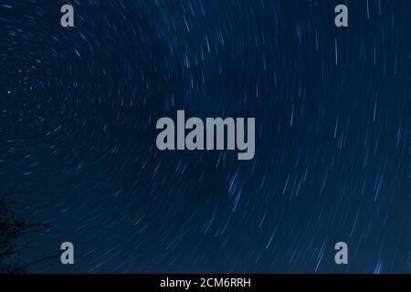 Star trails in the night sky. Stock Photo