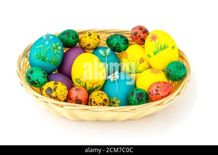 Easter eggs in a wooden basket, beautifully decorated eggs, isolated white background Stock Photo
