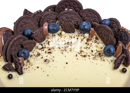 delicious and beautiful cake for a family bakery, with cookies and berries decoration, close-up Stock Photo