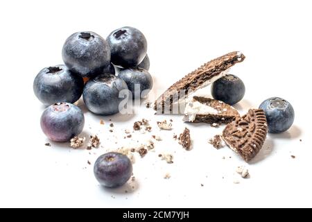 Chocolate cookies with blueberries, Breakfast, bakery. cake decorating. Delicious chocolate cookies for breakfast with milk and blueberries. Stock Photo