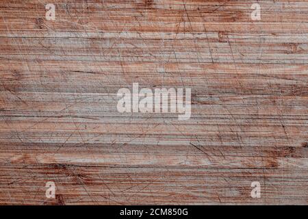 Texture of Old and used natural wooden cooking board with cuts background. Background of old wooden cutting board Stock Photo