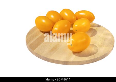 fresh tomato organza on wooden board, yellow tomato, bright tomatoes, isolated white background Stock Photo