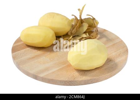 potatoes on wooden table, peeled potatoes, isolated on white background Stock Photo