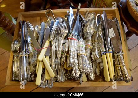 A selection of vintage cutlery for sale on display in an antiques centre in Leominster, Herefordshire Stock Photo