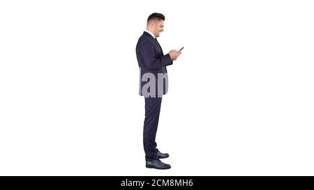 Mature businessman using mobile phone texting message on white b Stock Photo