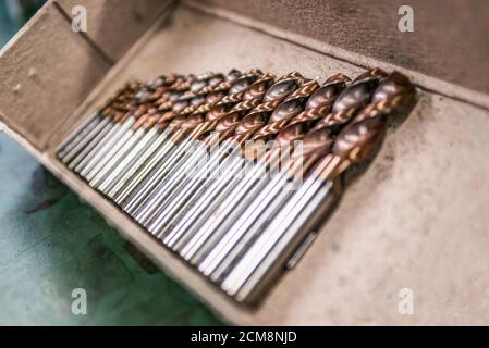 Flat lay various Size of cutting tools used carbide Endmills for machining center in metal work. Stock Photo