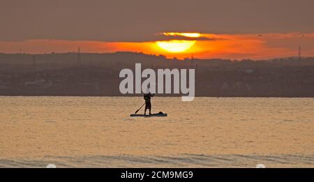 Portobello, Edinburgh, Scotland, UK. 17 September 2020. Temperature 10 degrees centigrade for those who ventured out on the Firth of Forth for sunrise to swim or use their stand up paddle board. Credit: Arch White/ Alamy Live News. Stock Photo