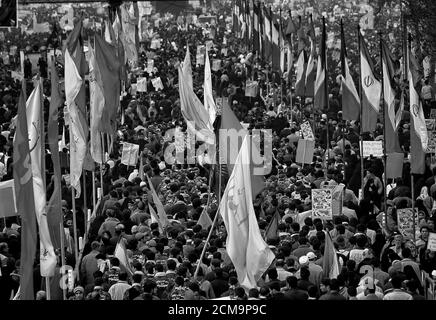 The people in the photo beats the slogan for the celebration of the Iranian revolution.Azadi of the Iranian revolution celebration in central Tehran. Stock Photo