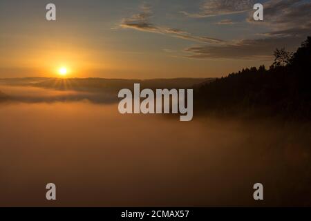 Belgian countryside - Ardennes. View over the Semois valley covered by clouds in the Belgian Ardennes in the early morning. Stock Photo