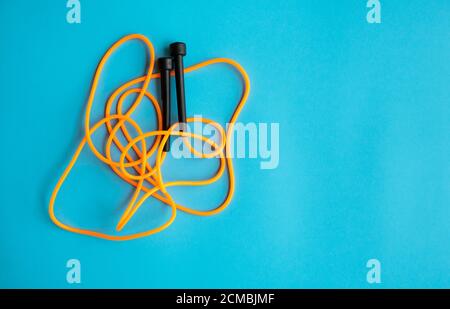 Skipping rope on blue background. Skip rope. Stock Photo