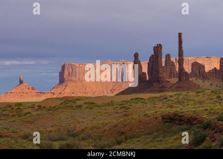 Monument Valley imposing structures of geological rock outcrops in contrast with shade and sun late afternoon light Utah USA Stock Photo