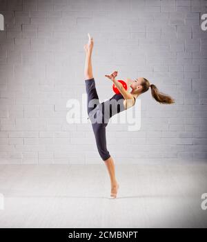 Young girl is engaged in art gymnastics Stock Photo