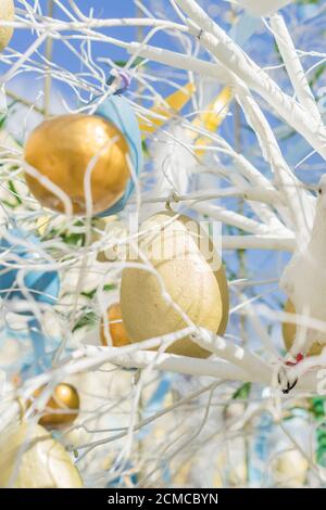 colorfull easter egg tree. brights eggs hanging from branches. Stock Photo
