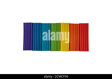 Rainbow colors of modeling clay. Multicolored plasticine bars isolated on white background. Stock Photo