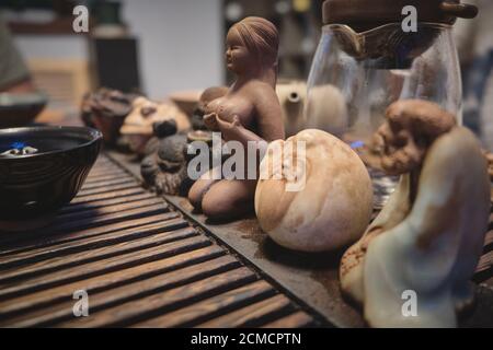 Tea god figurines and teaware on tea board. Traditional chinese tea ceremony Stock Photo