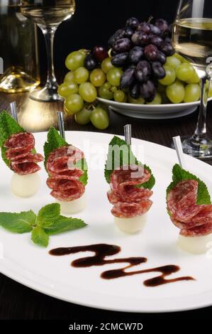 Canape of balls with a melon and salami Stock Photo