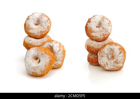 Fried donuts in powdered sugar on a white background Stock Photo