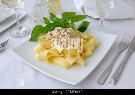 Italian pasta - Pappardelle with chicken fillet in a creamy sauce Stock Photo