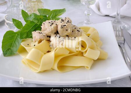 Italian pasta - Pappardelle with chicken fillet in a creamy sauce Stock Photo