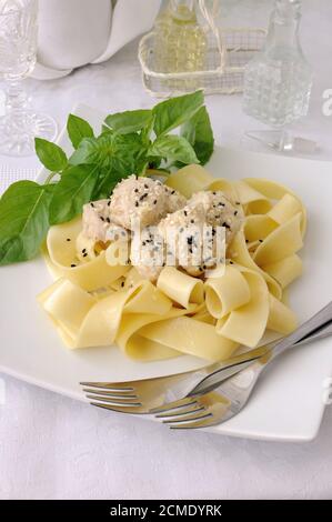 Italian pasta - Pappardelle with chicken fillet in a creamy sauce Stock Photo