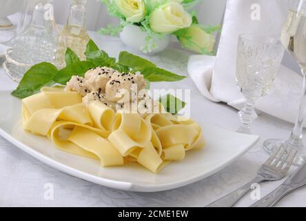 Italian pasta - Pappardelle with chicken fillet in a creamy sauce Stock Photo