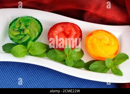 Jelly dessert of fresh fruit (oranges, grapefruit, kiwi) Stock Photo