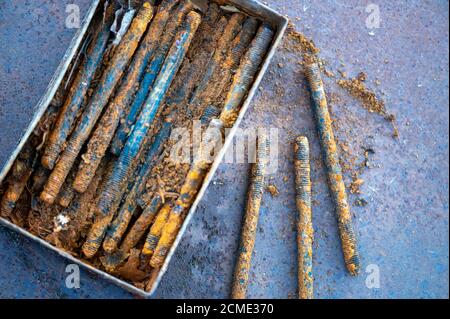 Old metal studs covered in rust, close-up, selective focus Stock Photo