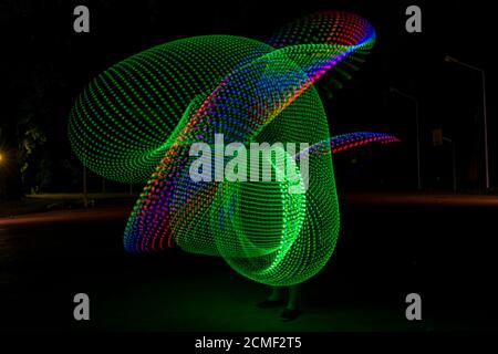 light painting picture with dancing girl with colored lights. High quality photo Stock Photo