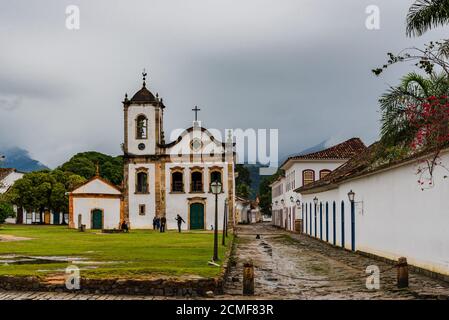 Front facade of old catholic church in a historical brazilian town Stock Photo