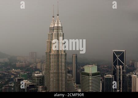 Kuala Lumpur, MALAYSIA - JANUARY 18, 2016: Dramatic scenery of the KualaLumpur city at sunset. View from the KL-Tower Menara . Stock Photo